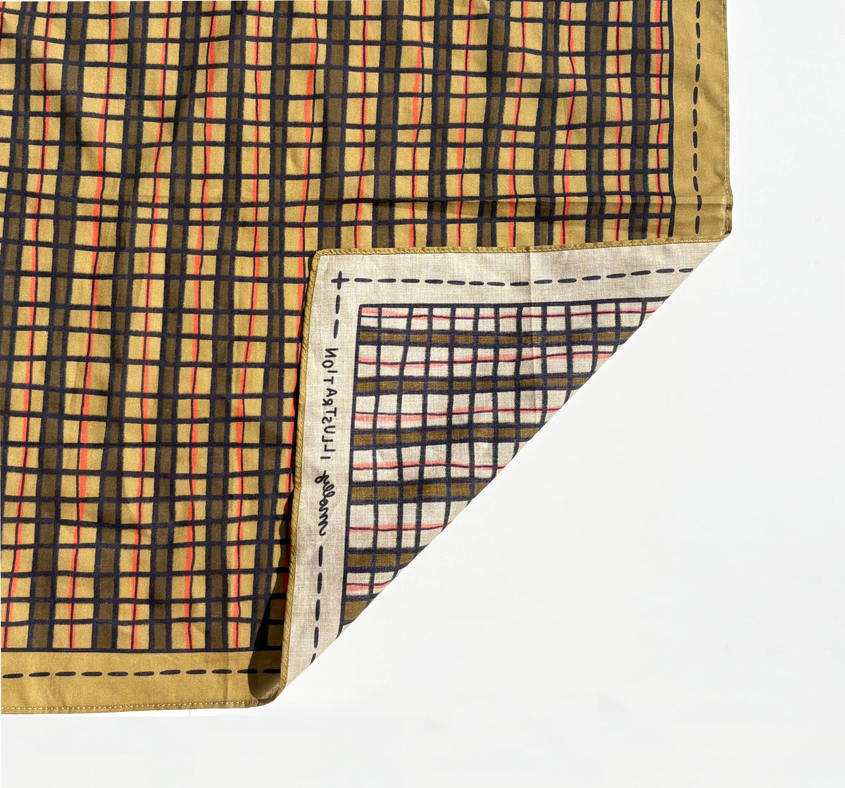 The Wonky Plaid bandana styled as an accessory