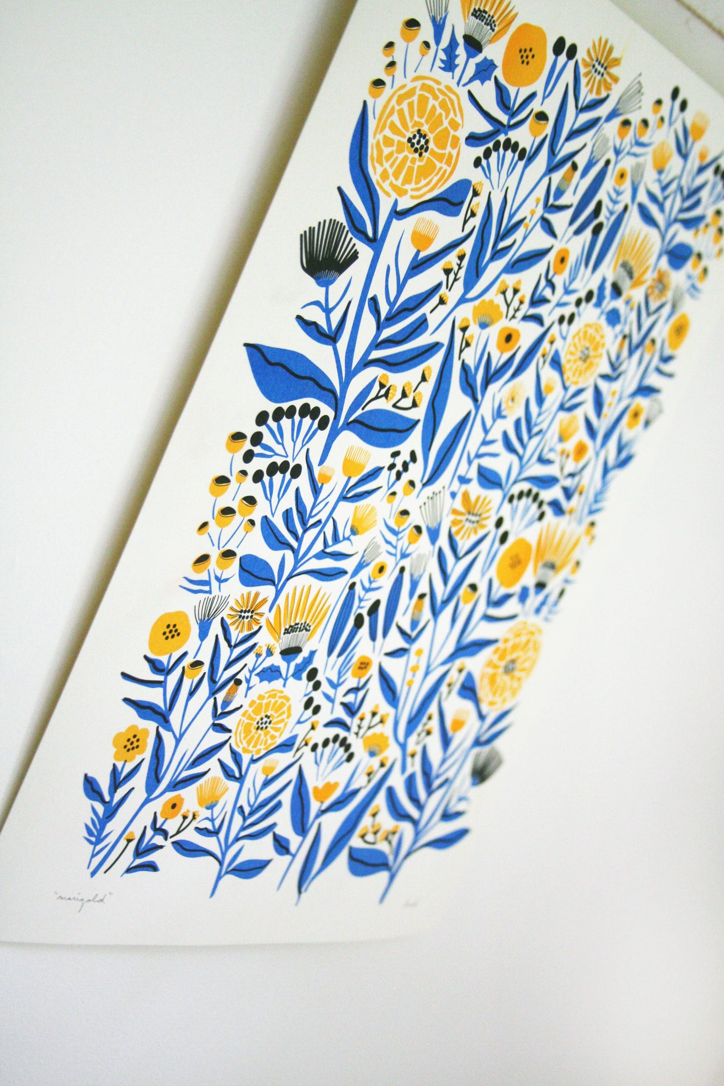 Marigold riso print by Leah Duncan, styled on a wall — PABOOM