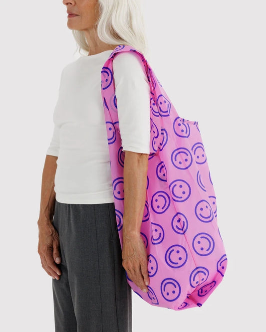 BAGGU Big Baggu reusable bag in Pop Pink Happy print folded flat - PABOOM