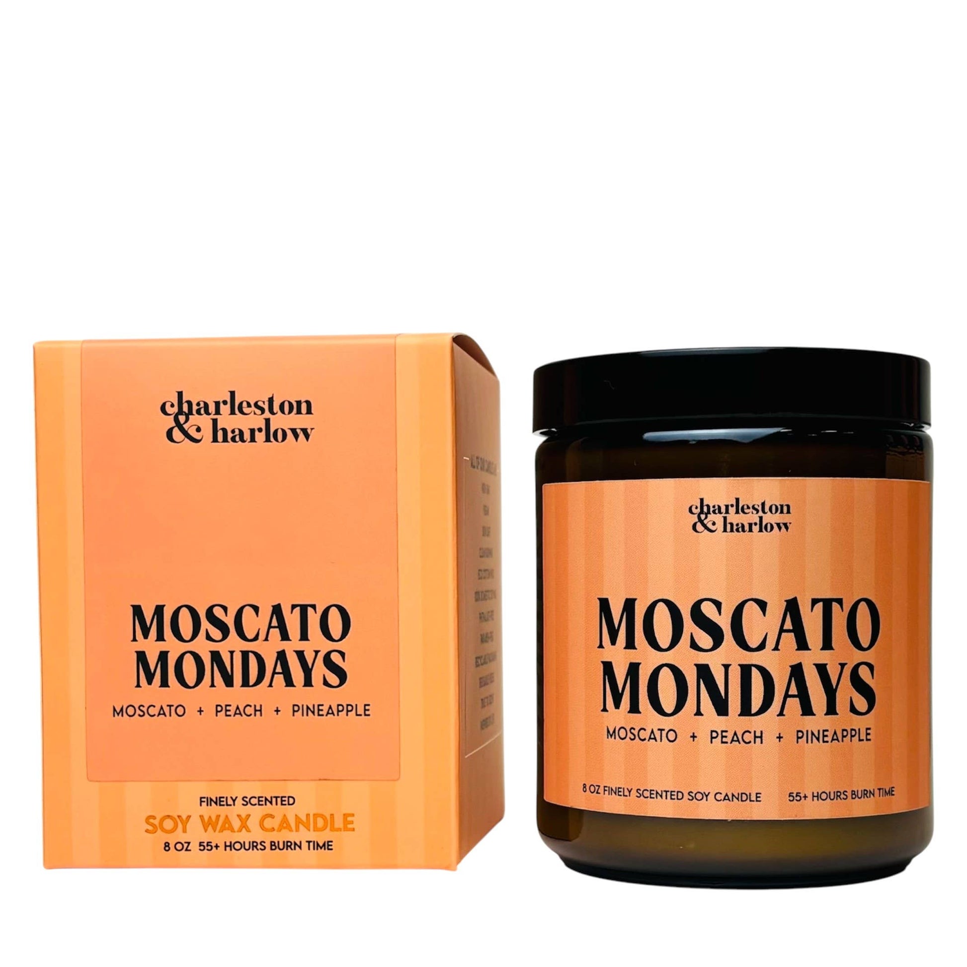 Charleston & Harlow Moscato Mondays soy candle in amber glass jar with peach striped label, beside its matching gift box