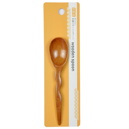 Wavy handle wooden spoon shown from a top-down angle