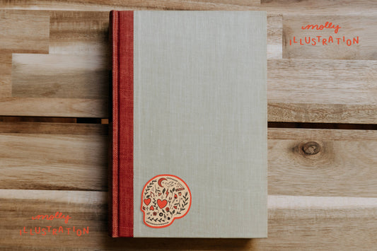 Close-up of the botanical skull design on the Heart Eyes sticker