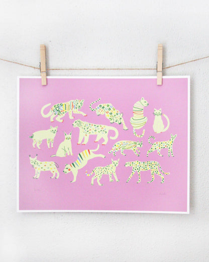 Art print of cream-coloured wild cats with rainbow spot patterns on a pink background, clipped to a string — PABOOM