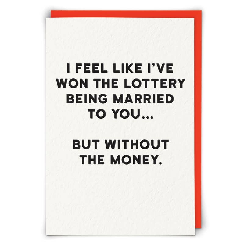 White card with bold black text 'I feel like I've won the lottery being married to you... but without the money.' - PABOOM