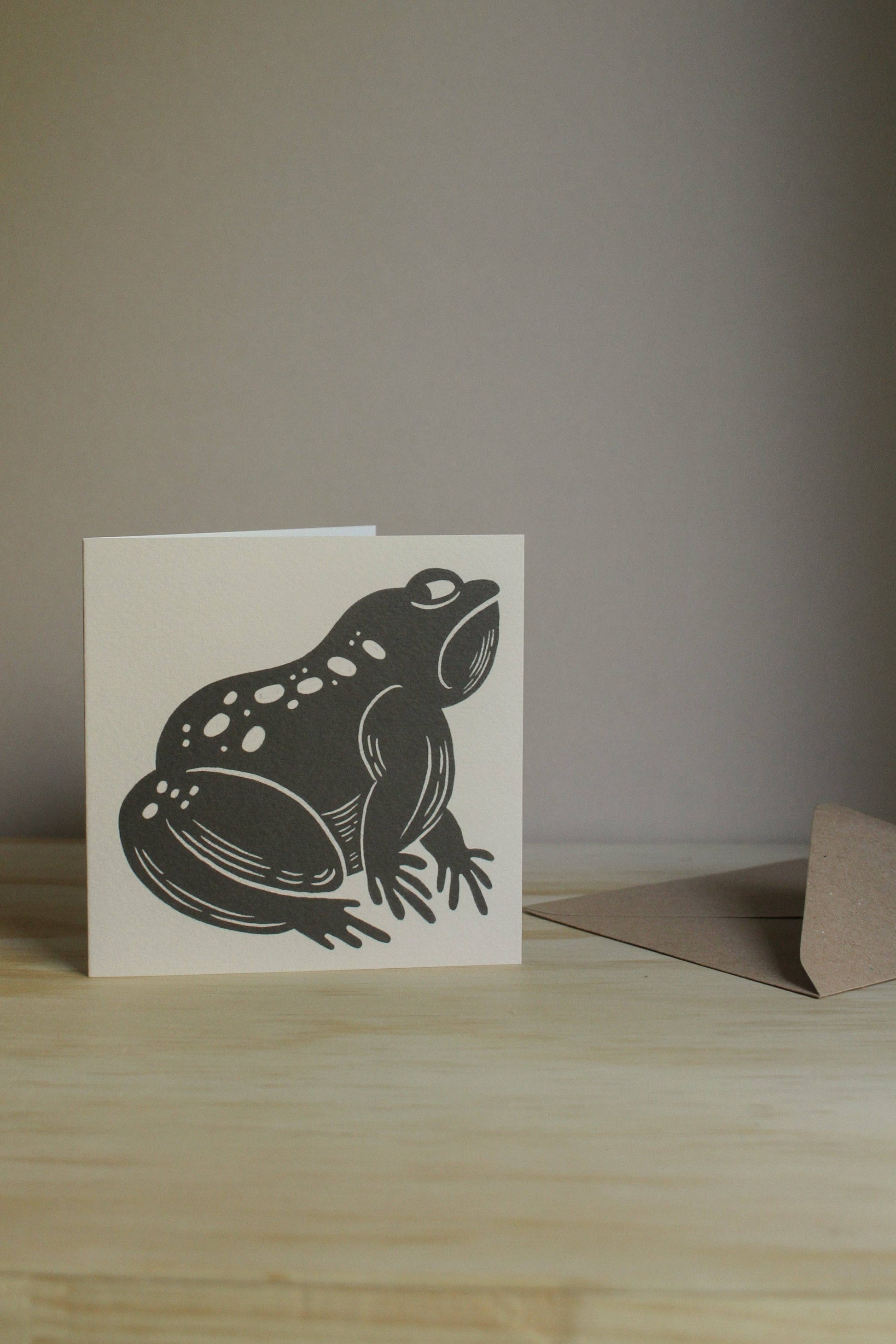 Close-up of the grumpy frog illustration showing textured linework detail