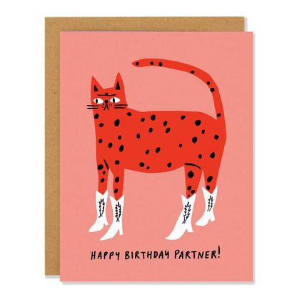 Pink birthday card of a spotted red cat wearing white cowboy boots with Happy Birthday Partner lettering - PABOOM