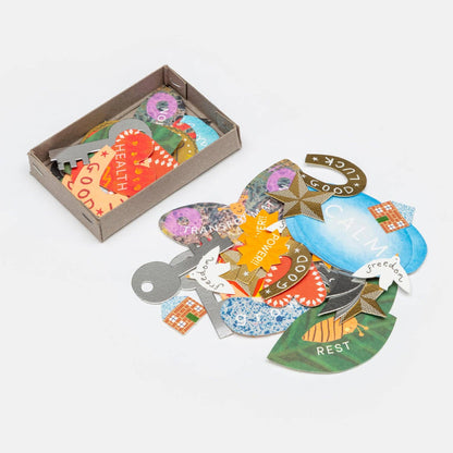 Manifestation Charms in packaging box