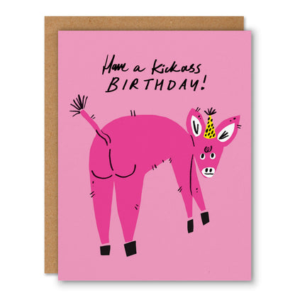 Pink greeting card of a hot pink donkey in a party hat kicking its legs with Have a Kickass Birthday lettering - PABOOM