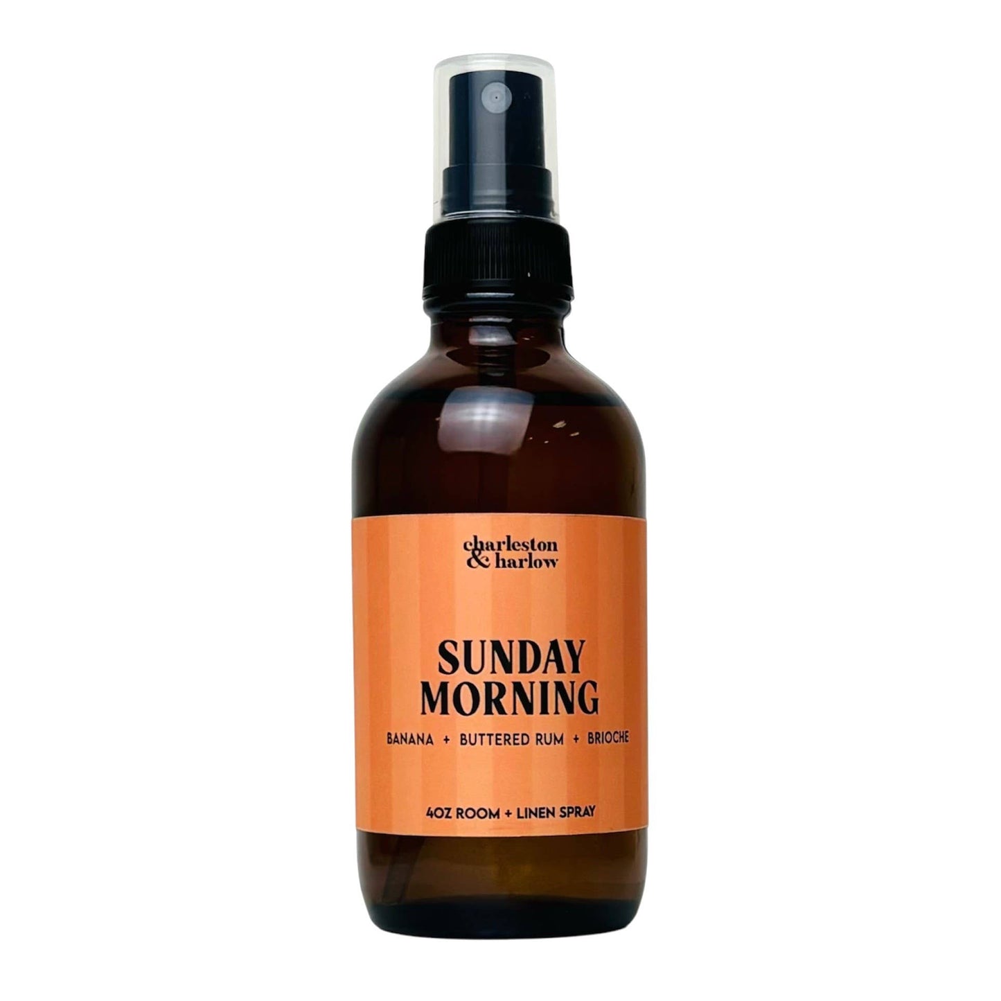 Amber glass spray bottle of Charleston & Harlow Sunday Morning room and linen spray with peach striped label