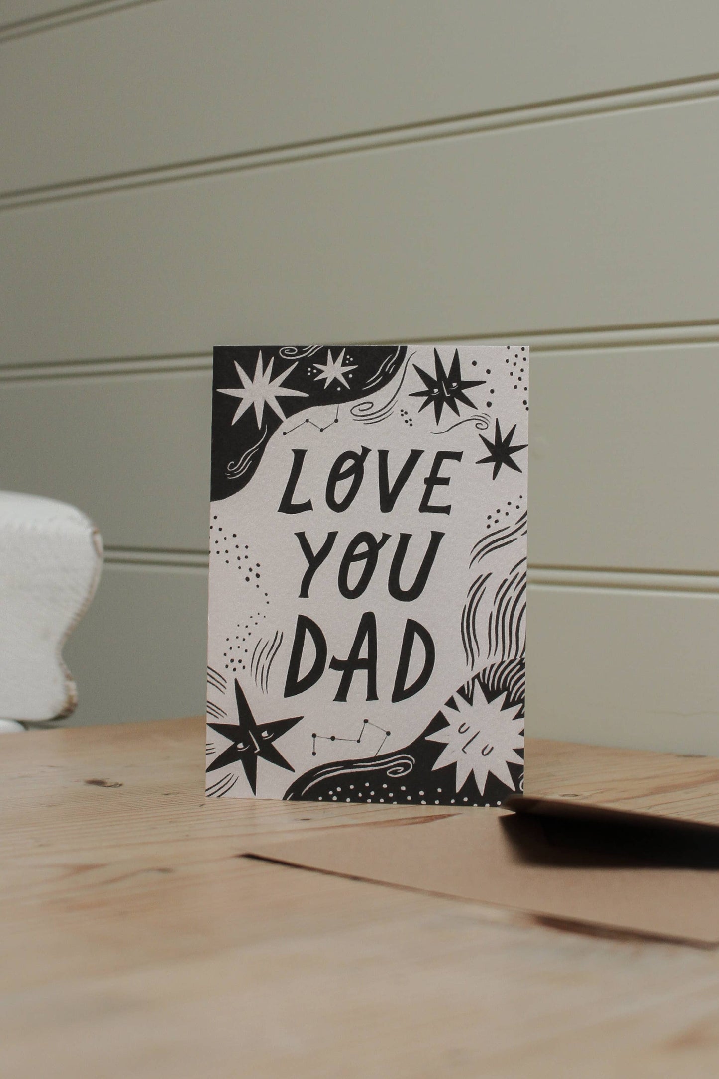 'Love You Dad' card with kraft envelope on a light background