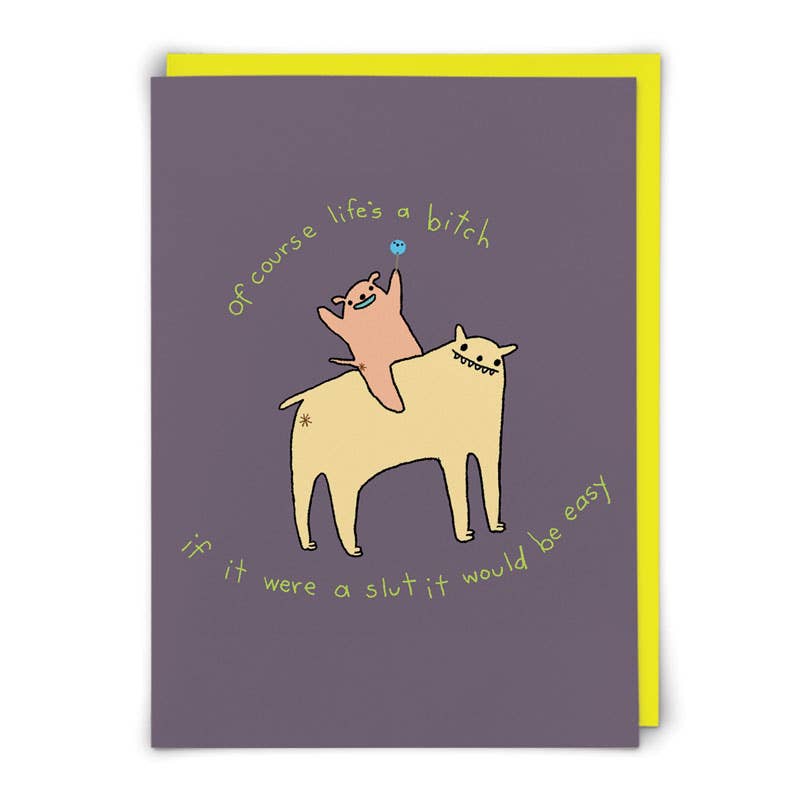 Purple card with a pink cat riding a yellow dog, hand-lettered text 'of course life's a bitch' - PABOOM