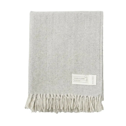 Grey herringbone wool throw folded to show fringe detail - PABOOM