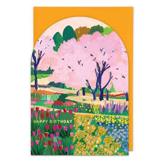 Arched birthday card with pink cherry blossom trees over rows of tulips and wildflowers, 'Happy Birthday' text - PABOOM