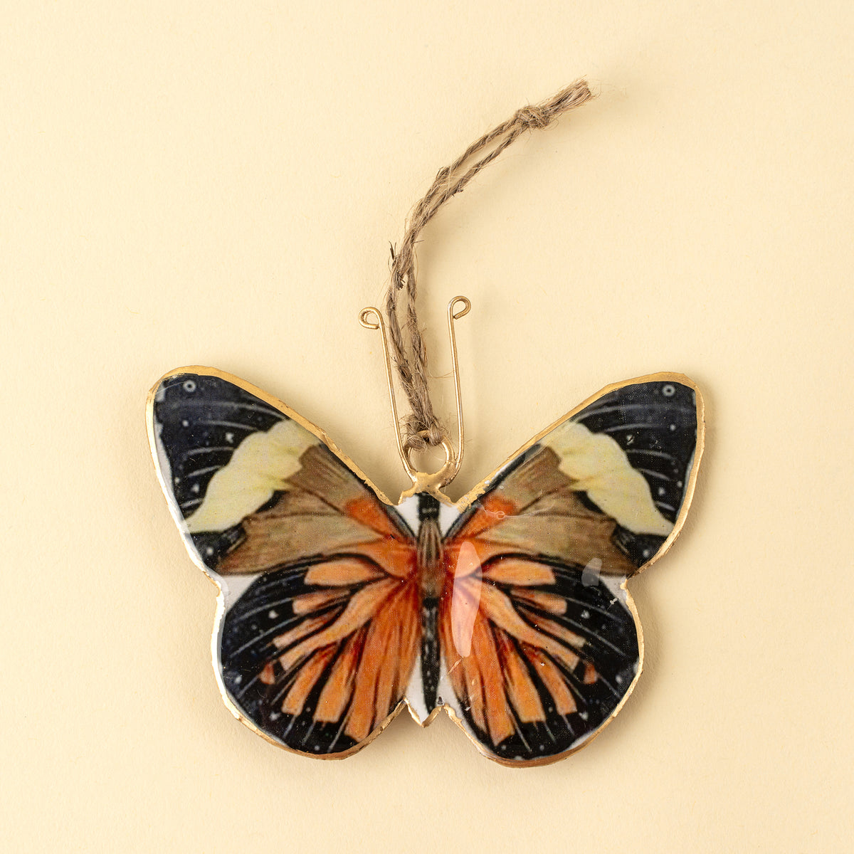 Keepsake Iron Ornament with orange and black butterfly print on a white background - PABOOM