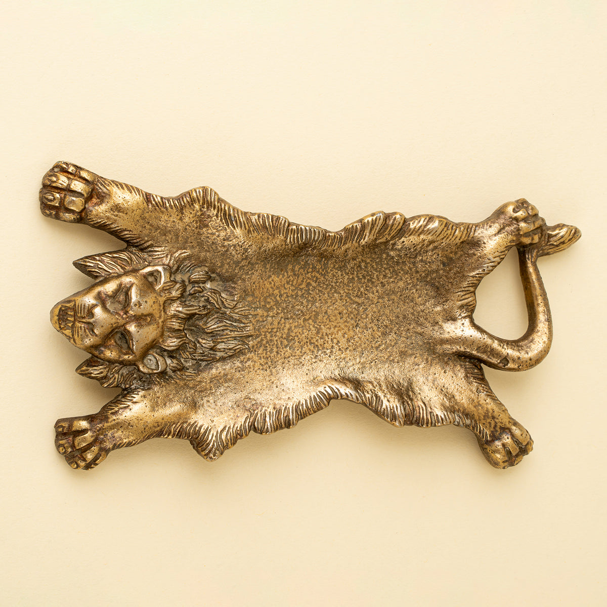 Lionheart Catchall Dish shaped like a reclining lion on a white background - PABOOM