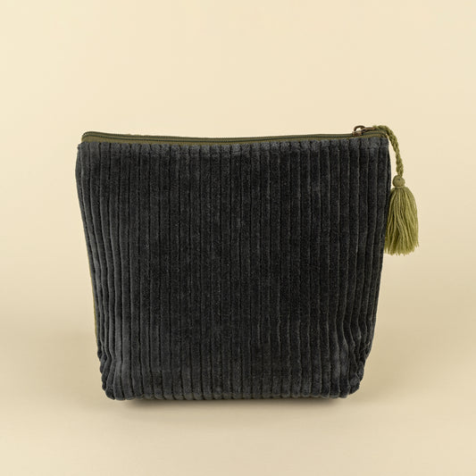 Dark navy corduroy velvet vanity pouch with an olive green tassel zipper pull