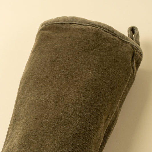 Vera Velvet Stocking in Olive hung on a mantel