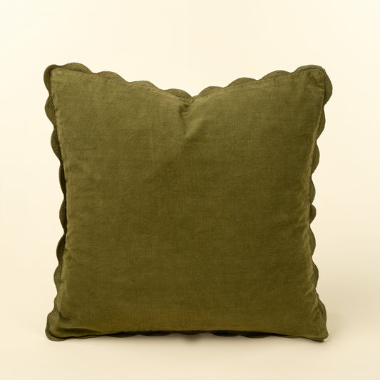 Square moss green corduroy pillow with a tone-on-tone scalloped edge