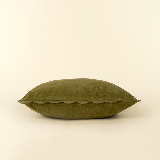 Corduroy Scallop Pillow in Moss styled on a sofa