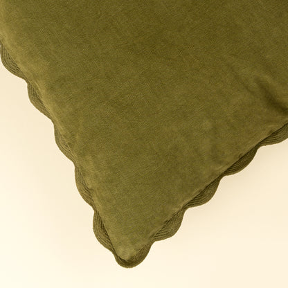 Close-up of the tone-on-tone scalloped edge on the Corduroy Scallop Pillow in Moss