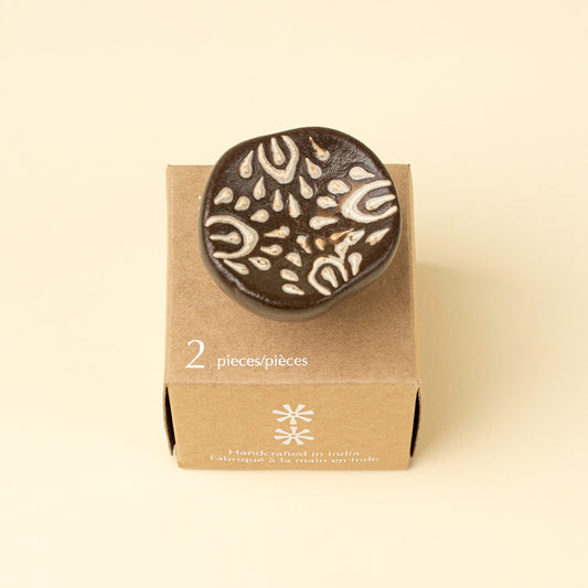Earthen Ceramic Knobs in Brown shown installed on a drawer