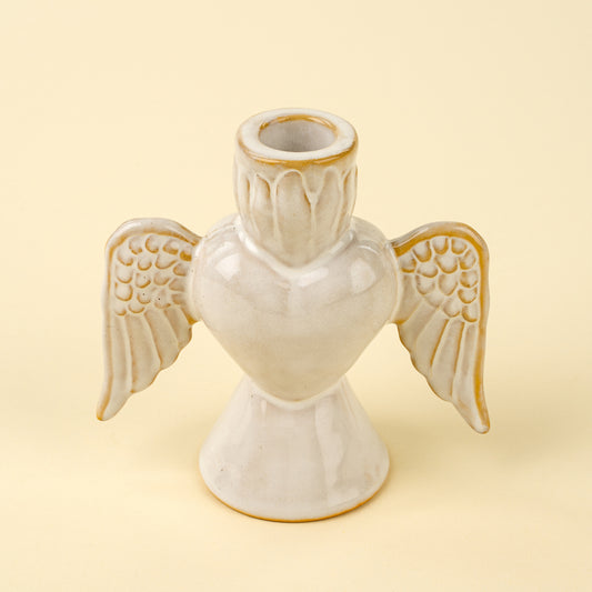 Cream stoneware angel-shaped candle holder with detailed wings
