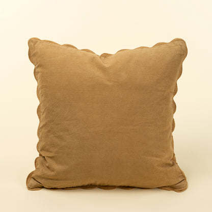 Square tan-gold corduroy pillow with a tone-on-tone scalloped edge