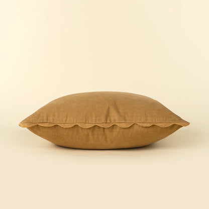 Corduroy Scallop Pillow in Gold styled on a sofa