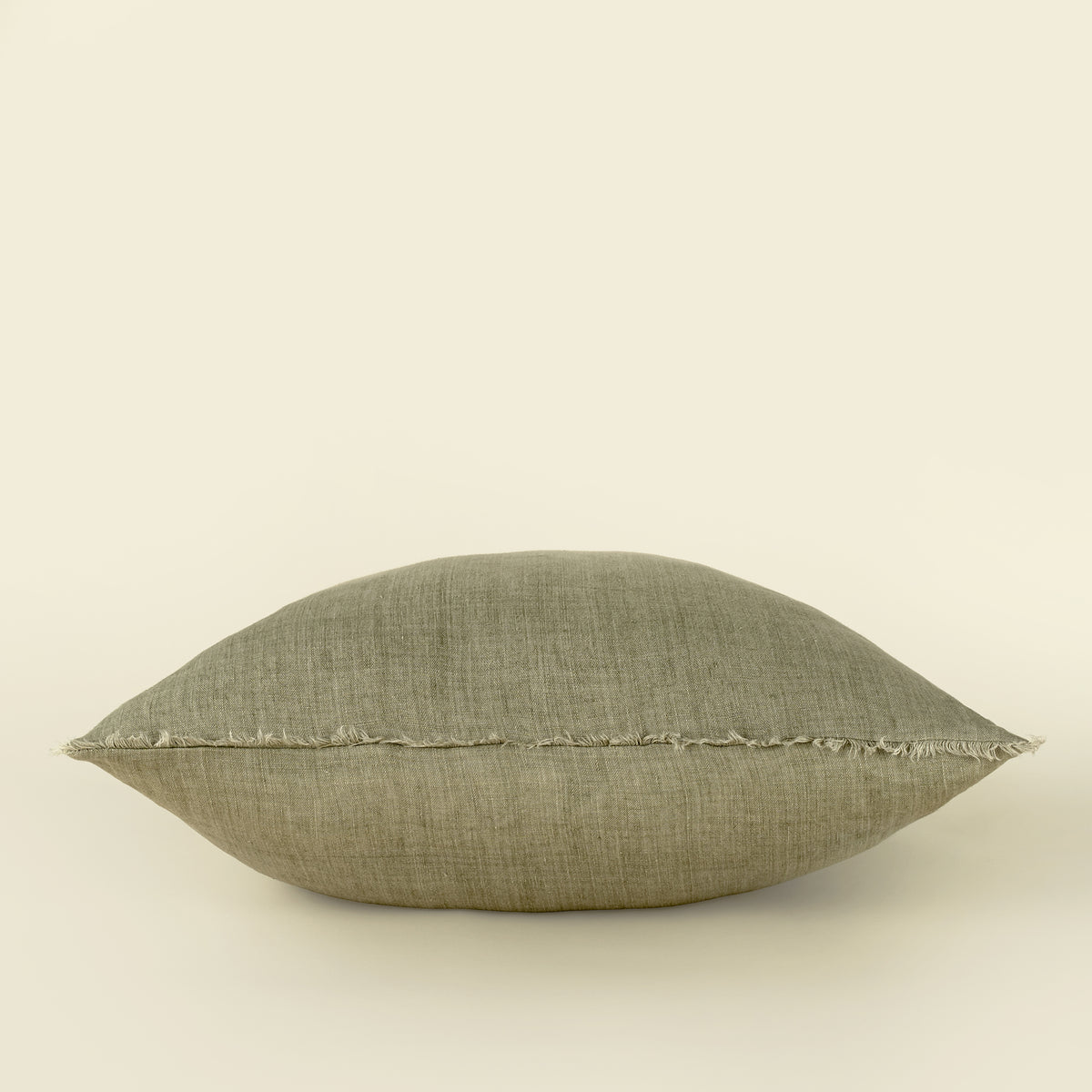 Lina Linen Pillow in Driftwood shown from a different angle highlighting the frayed edge
