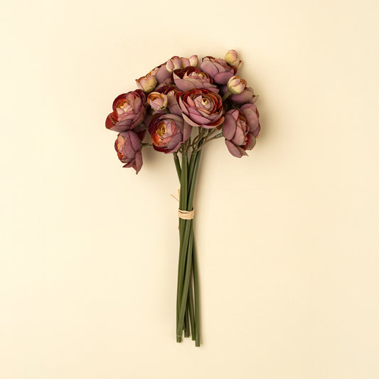 Bundle of deep pink faux ranunculus flowers tied with raffia