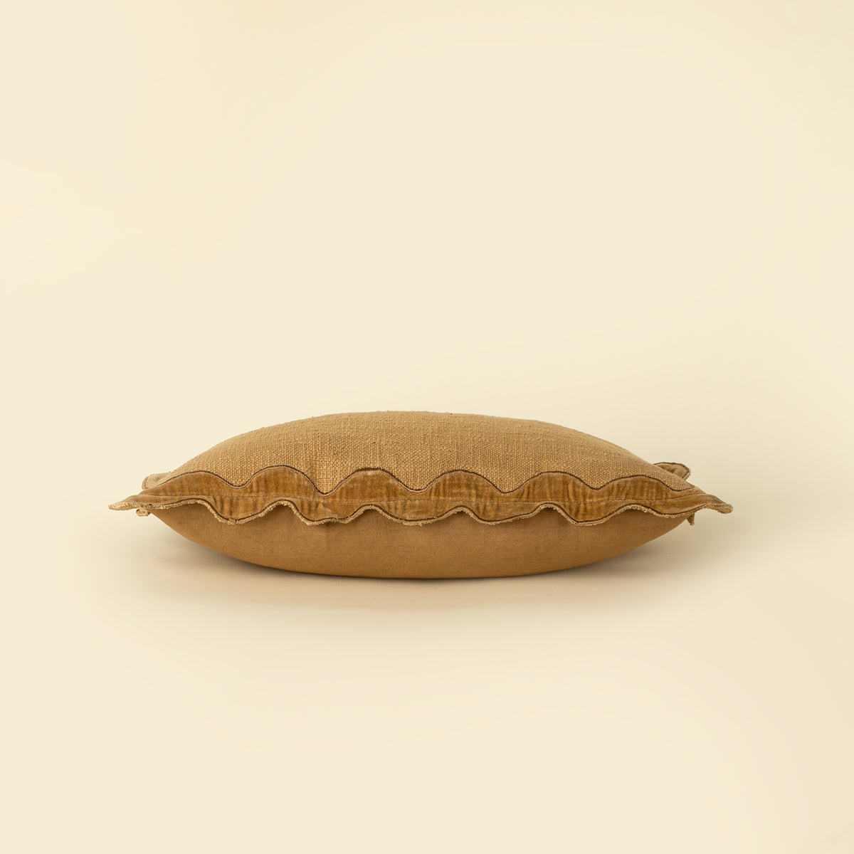 Close-up of the scalloped velvet border on the Velvet Scallop Pillow in Gold