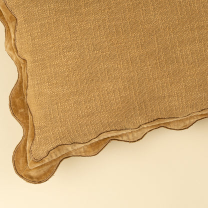 Velvet Scallop Pillow in Gold styled on a bed