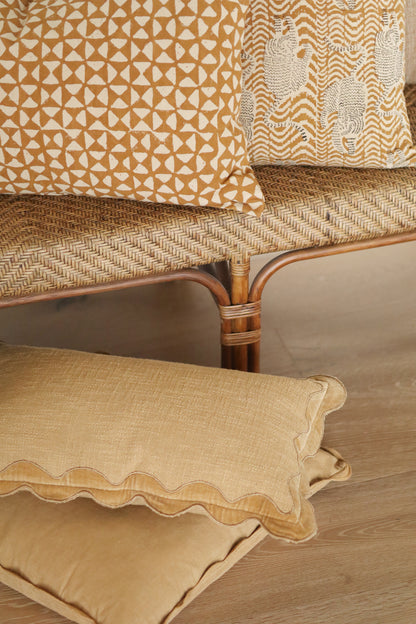 Velvet Scallop Pillow in Gold shown from a side angle