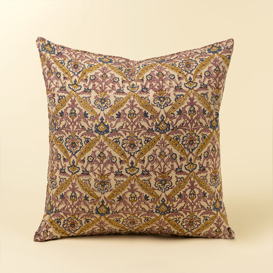 Square lumbar pillow with hand block printed floral vine pattern in pink, blue, and mustard