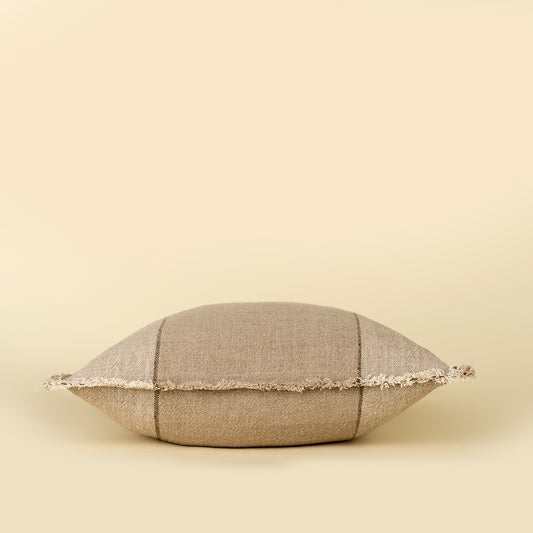 Percy Pillow in Sand styled on a sofa