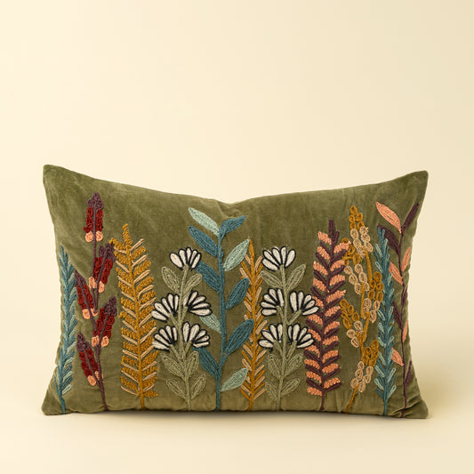 Olive green velvet lumbar pillow with a colourful embroidered botanical stripe motif