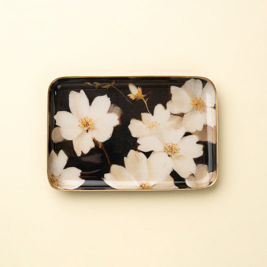 Small rectangular black enameled tray with white cherry blossom print and a gold border