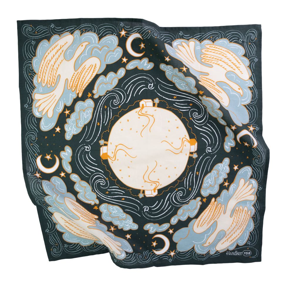 Luna Bandana flat lay in dark teal, blue, cream and orange