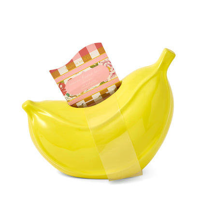 Glossy yellow ceramic Banana Tissue Box with a tissue peeking out from the top