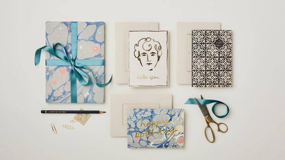 Blue Marble Happy Birthday card paired with a warm grey envelope