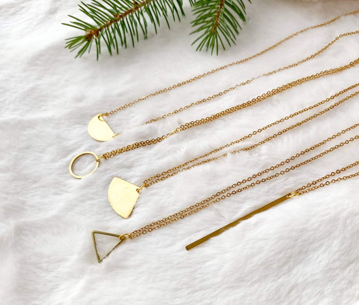 Model wearing raw brass circle pendant necklace
