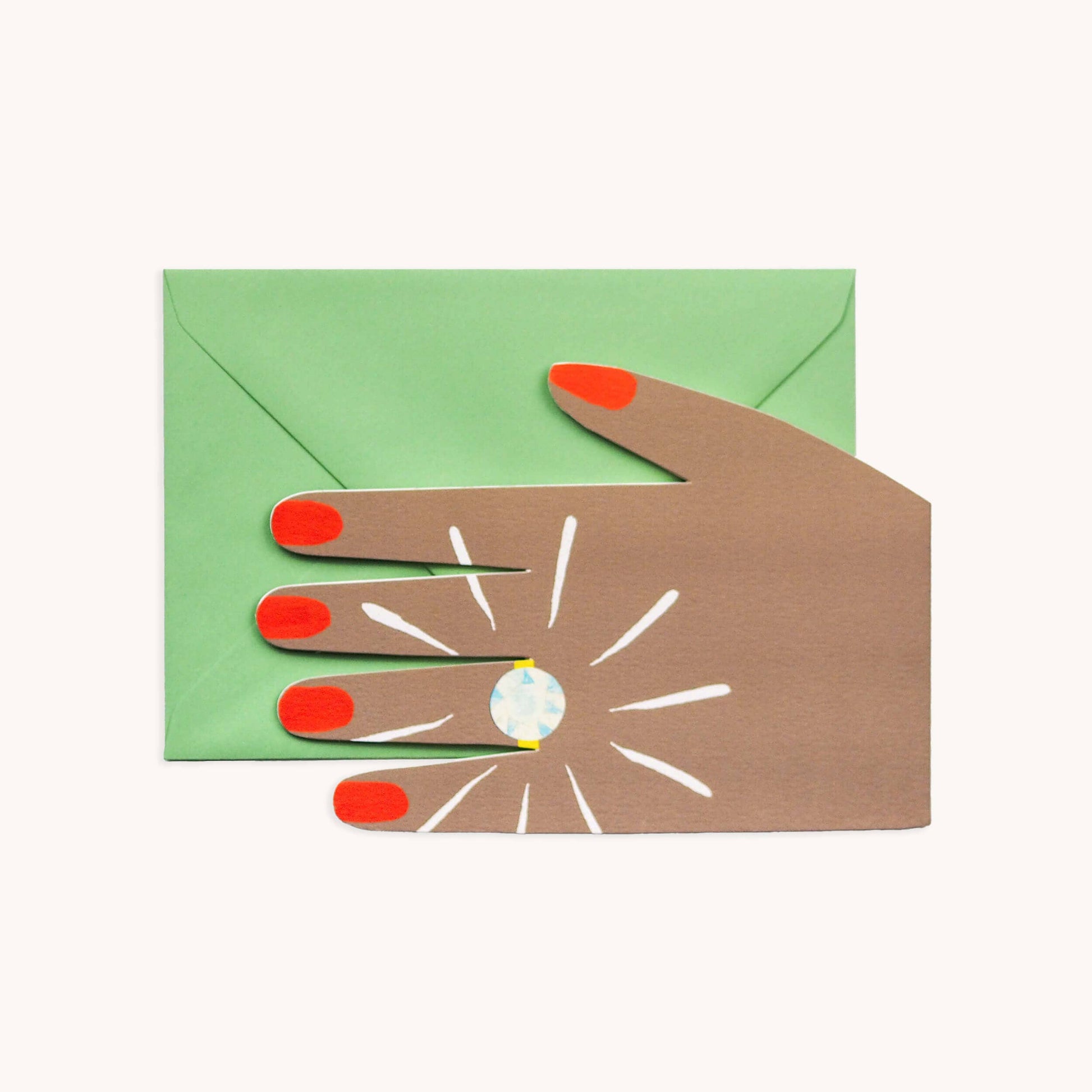 Green greeting card with a large illustrated hand with red painted nails wearing a sparkling diamond ring