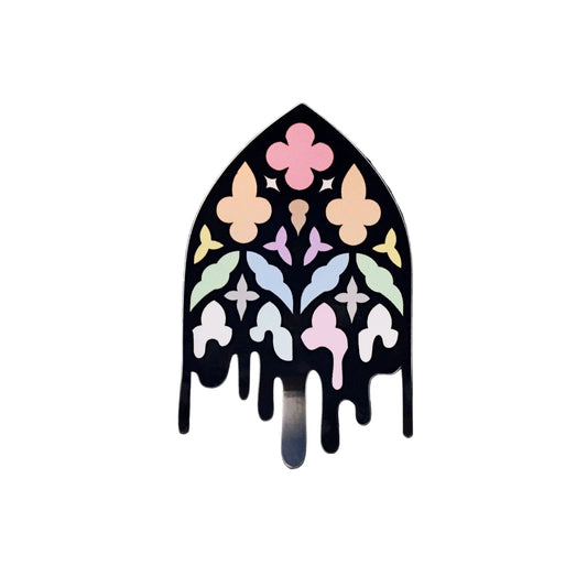 Waterproof vinyl die-cut sticker shaped like a gothic cathedral window in pastel rainbow stained-glass colours with a dripping black outline