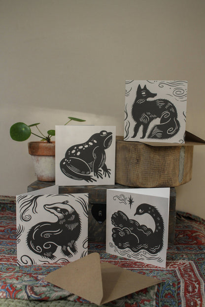 'The Badger' square animal card displayed at an angle with envelope