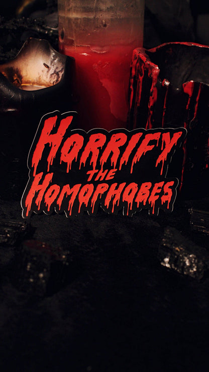Horrify The Homophobes sticker applied to a laptop lid for scale
