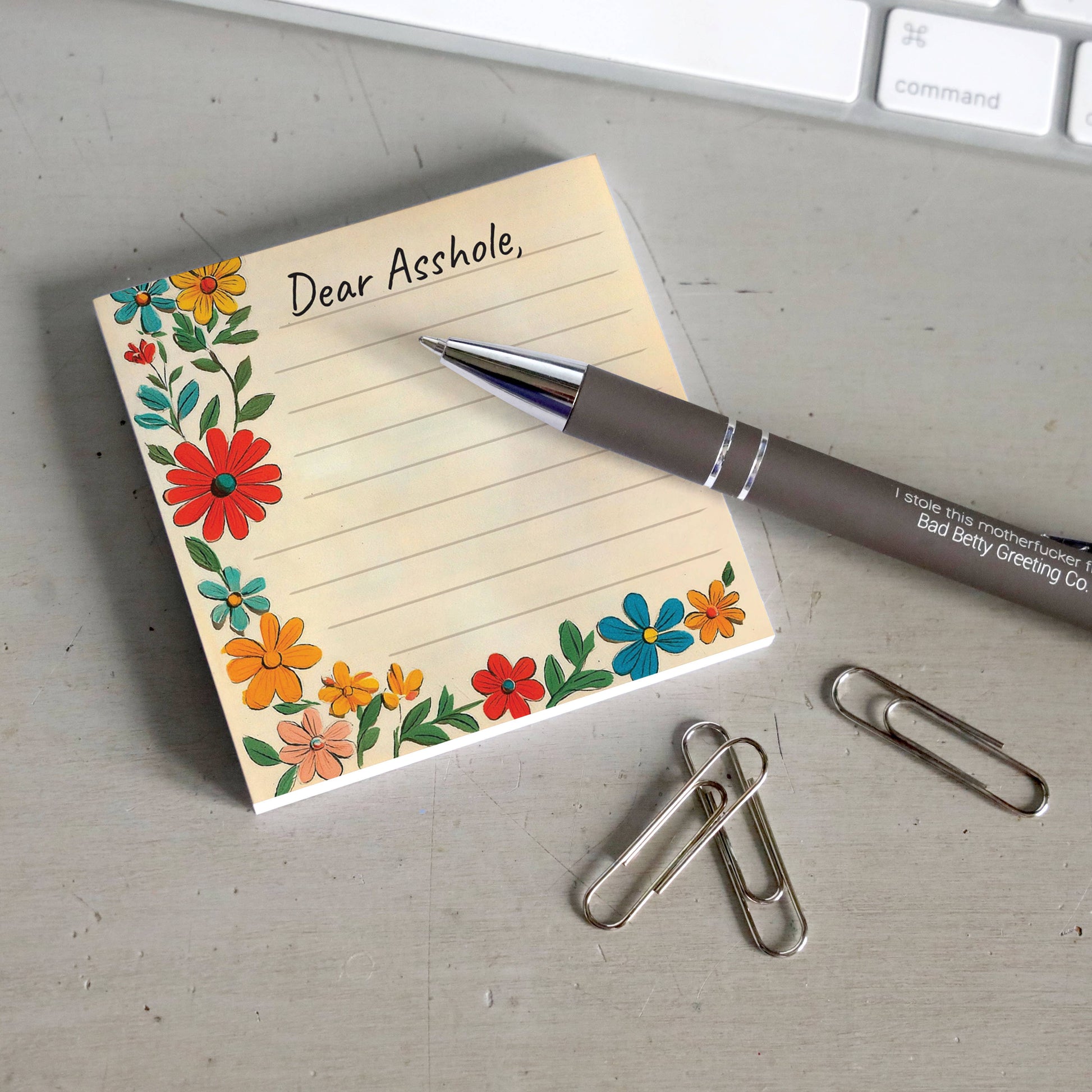 Dear Asshole sticky note pad shown from another angle