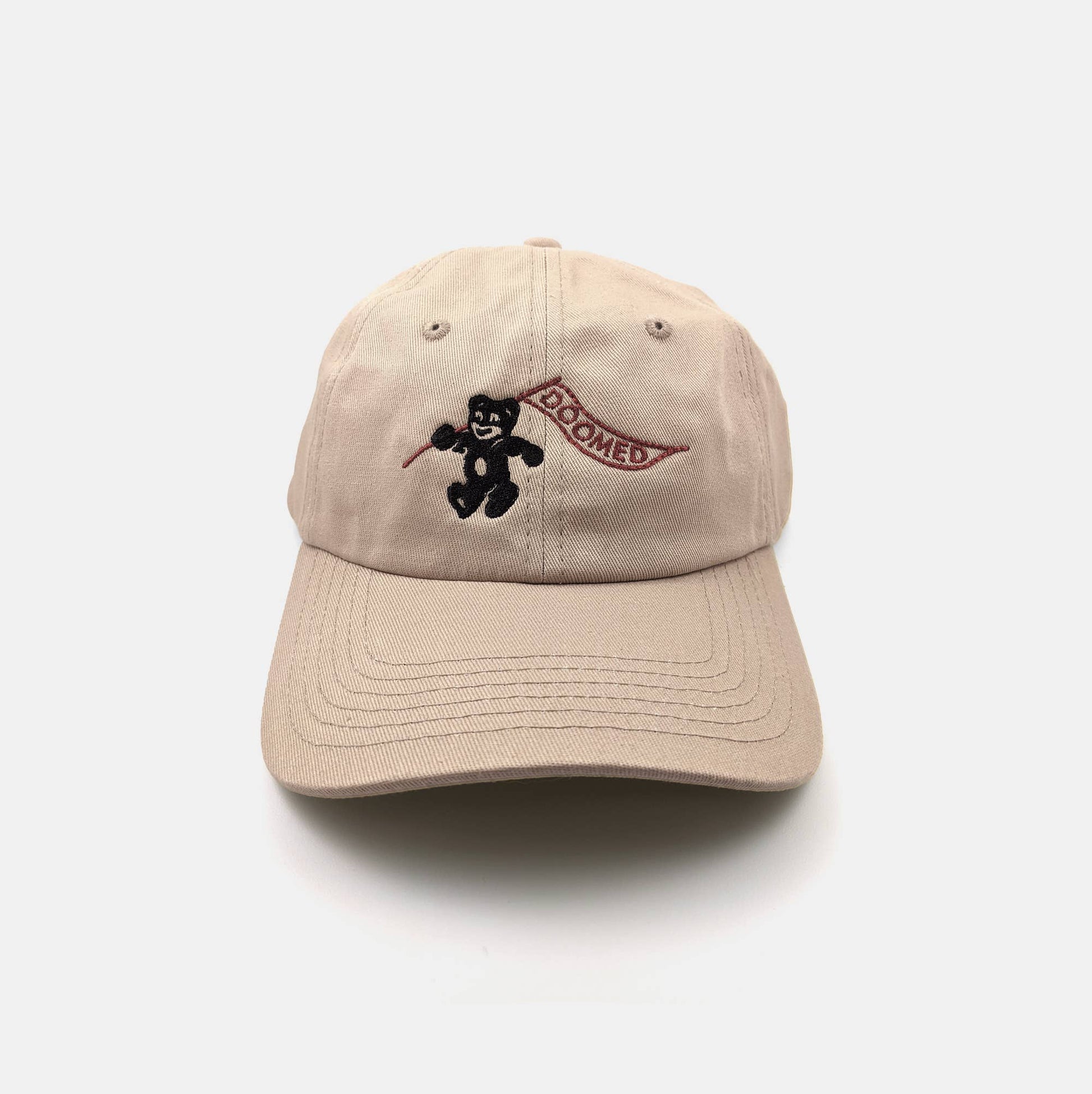 Tan dad hat embroidered with a bear mascot holding a banner reading Doomed - PABOOM