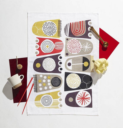 Tulips tea towel folded and displayed in kitchen setting - PABOOM