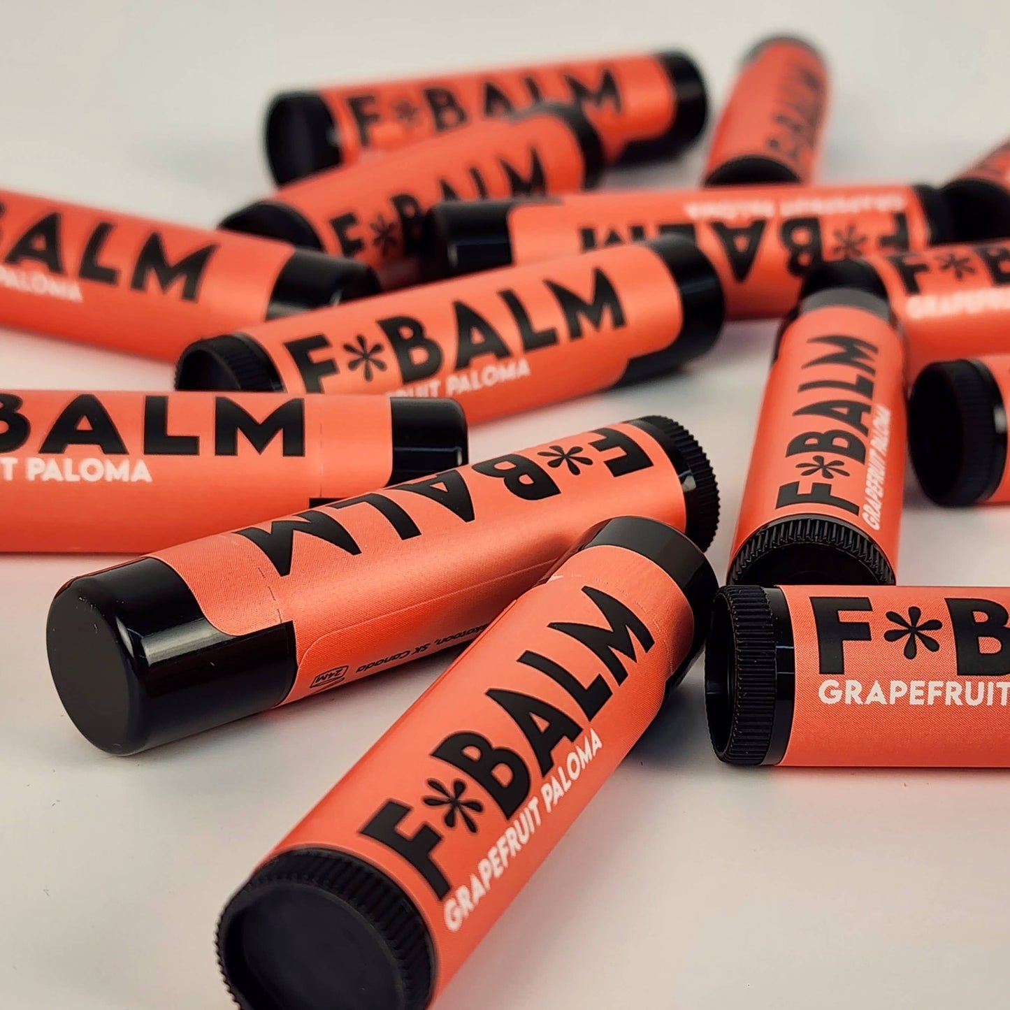 Charleston & Harlow Grapefruit Paloma lip balm tube styled shot