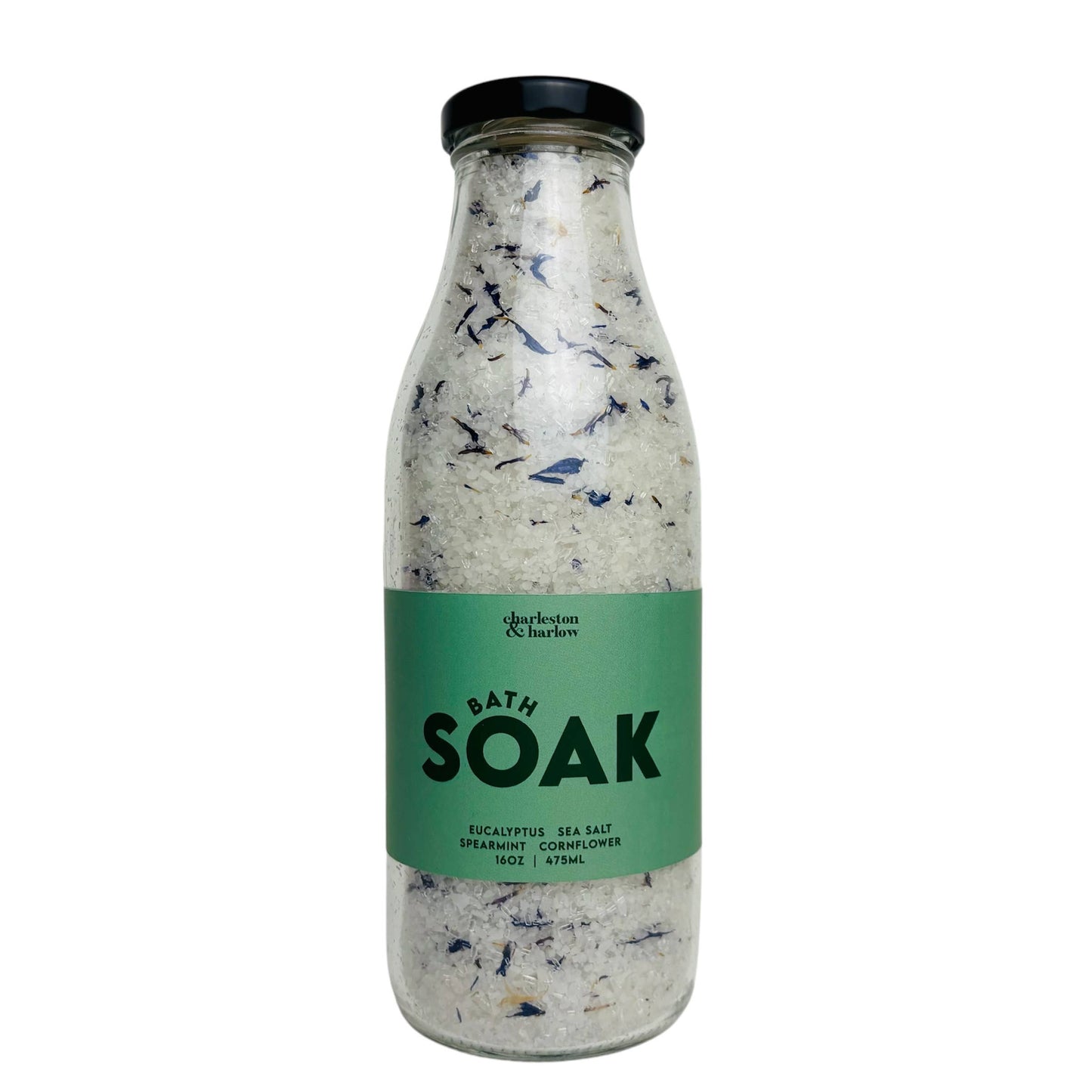 Glass bottle of Charleston & Harlow Bath Soak with green label, eucalyptus and cornflower petal salt blend